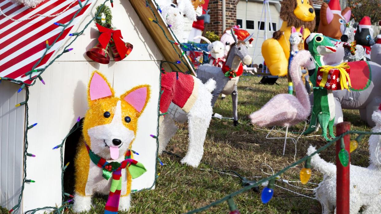 diy doghouse decoration highlights a christmas yard full of various fun animals