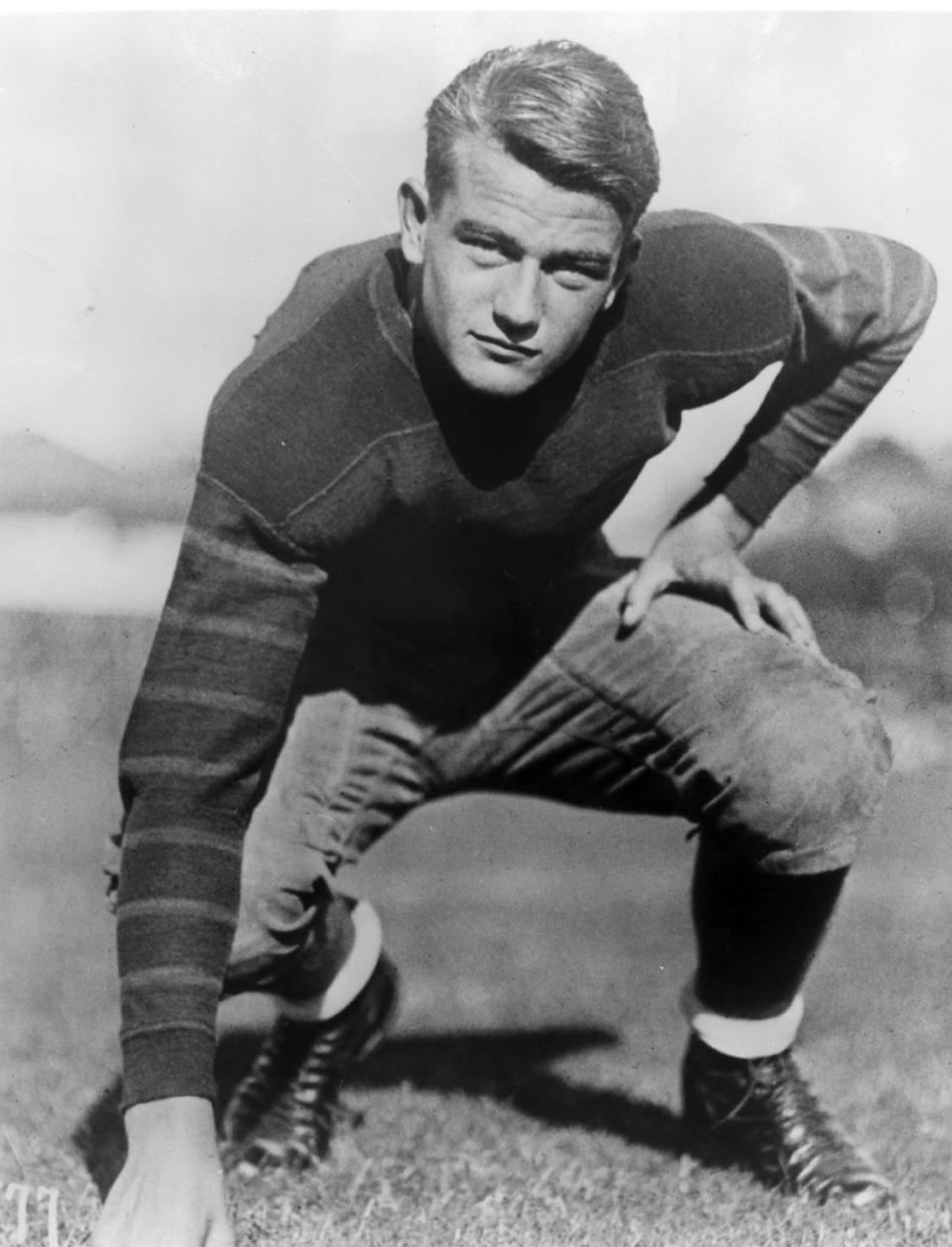 <p>John Wayne got into the University of Southern California for a <a href="https://news.usc.edu/15621/john-wayne-an-american-icon/" rel="nofollow noopener" target="_blank" data-ylk="slk:football scholarship in 1925;elm:context_link;itc:0;sec:content-canvas" class="link ">football scholarship in 1925</a>. Unfortunately, the future Western movie star broke his collarbone surfing and lost his scholarship at the beginning of his junior year. </p>
