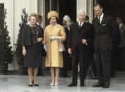 FILE - President Heinrich Lubke of West Germany, centre right, stands with Britain's Queen Elizabeth II, the first British monarch to visit Germany for 52 years, after her arrival at Villa Hammerschmidt, the presidential residence near Bonn, West Germany, May 18, 1965. Queen Elizabeth II, Britain’s longest-reigning monarch and a rock of stability across much of a turbulent century, has died. She was 96. Buckingham Palace made the announcement in a statement on Thursday Sept. 8, 2022.(AP Photo, File)