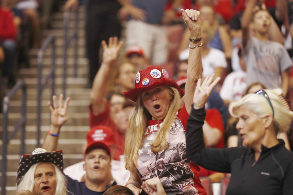 Supports cheer before President Donald Trump's rally on Tuesday, Nov. 26, 2019, in Sunrise, Fla. (AP Photo/Brynn Anderson)