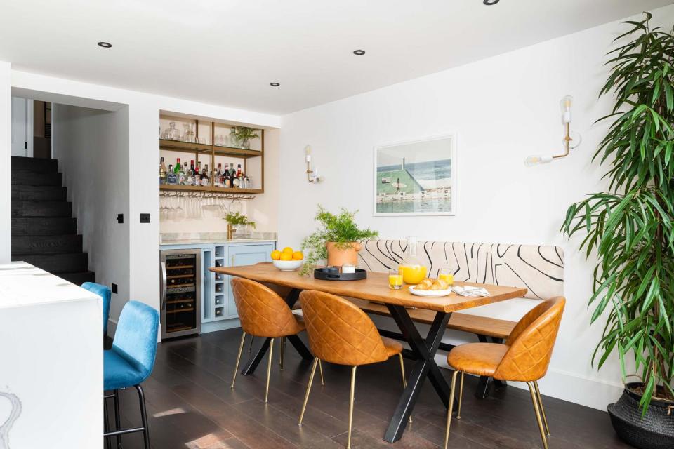 <p>At first you don't notice that this set-up is actually a bench with an upholstered panel lining on the wall, but it's a cost-effective alternative to elevating a simple seating arrangement, and it gives you a chance to be creative with fabric choice.</p><p>Pictured: A dining room by <a href="https://www.interiorfox.co.uk/" rel="nofollow noopener" target="_blank" data-ylk="slk:Interior Fox;elm:context_link;itc:0;sec:content-canvas" class="link ">Interior Fox</a><br></p>
