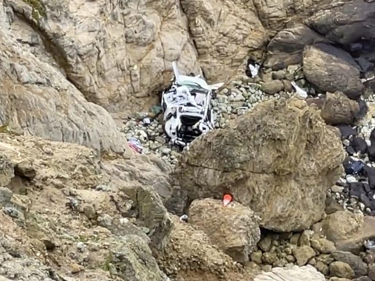 A Tesla plunged off a 250-foot cliff on Monday.