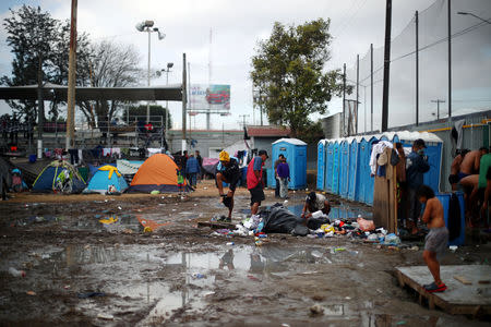 Migrants, part of a caravan of thousands from Central America trying to reach the United States, are seen in a temporary shelter in Tijuana, Mexico, November 28, 2018. REUTERS/Hannah McKay