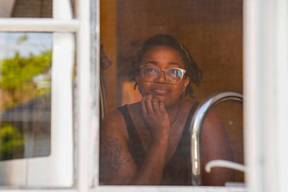 Alisha Washington, 30, of Detroit, in her kitchen in Detroit on Friday, Aug. 18, 2023. "My kitchen is a place of recovery me, and struggle," Washington said. "Having disordered eating when you love food is such a weird thing because I love cooking, I love cooking for people, I love feeding people, but you might make a full meal and be like I don't want to eat any of this." Washington said one of her favorite things to make is brownies. "I will die saying boxed brownies are better than homemade," she said.