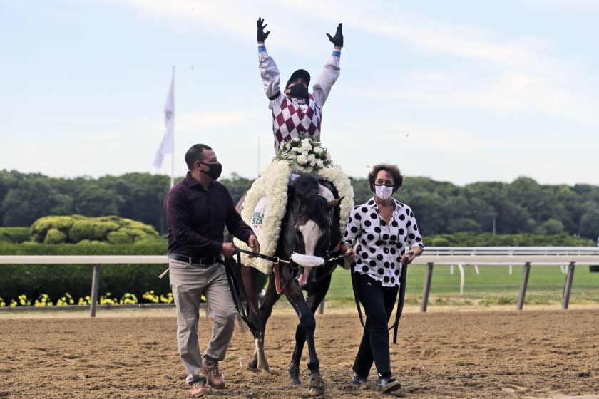 Jockey Manny Franco reacts after winning the 152nd running of the Belmont Stakes horse race with Tiz the Law, Saturday, June 20, 2020, in Elmont, N.Y. (AP Photo/Seth Wenig)