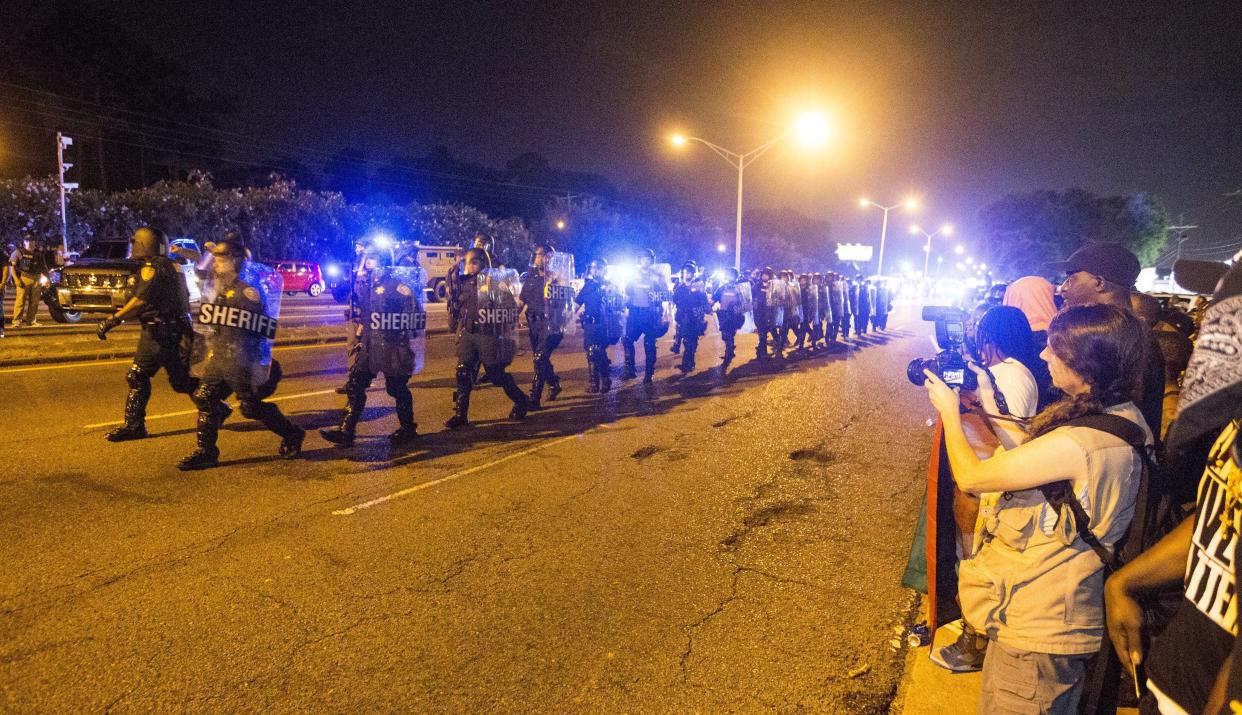 BATON ROUGE, LA -JULY 09: Law enforcement leave the protesters after moving in and making arrest on July 9, 2016 in Baton Rouge, Louisiana. Alton Sterling was shot by a police officer in front of the Triple S Food Mart in Baton Rouge on July 5th, leading the Department of Justice to open a civil rights investigation. (Photo by Mark Wallheiser/Getty Images)