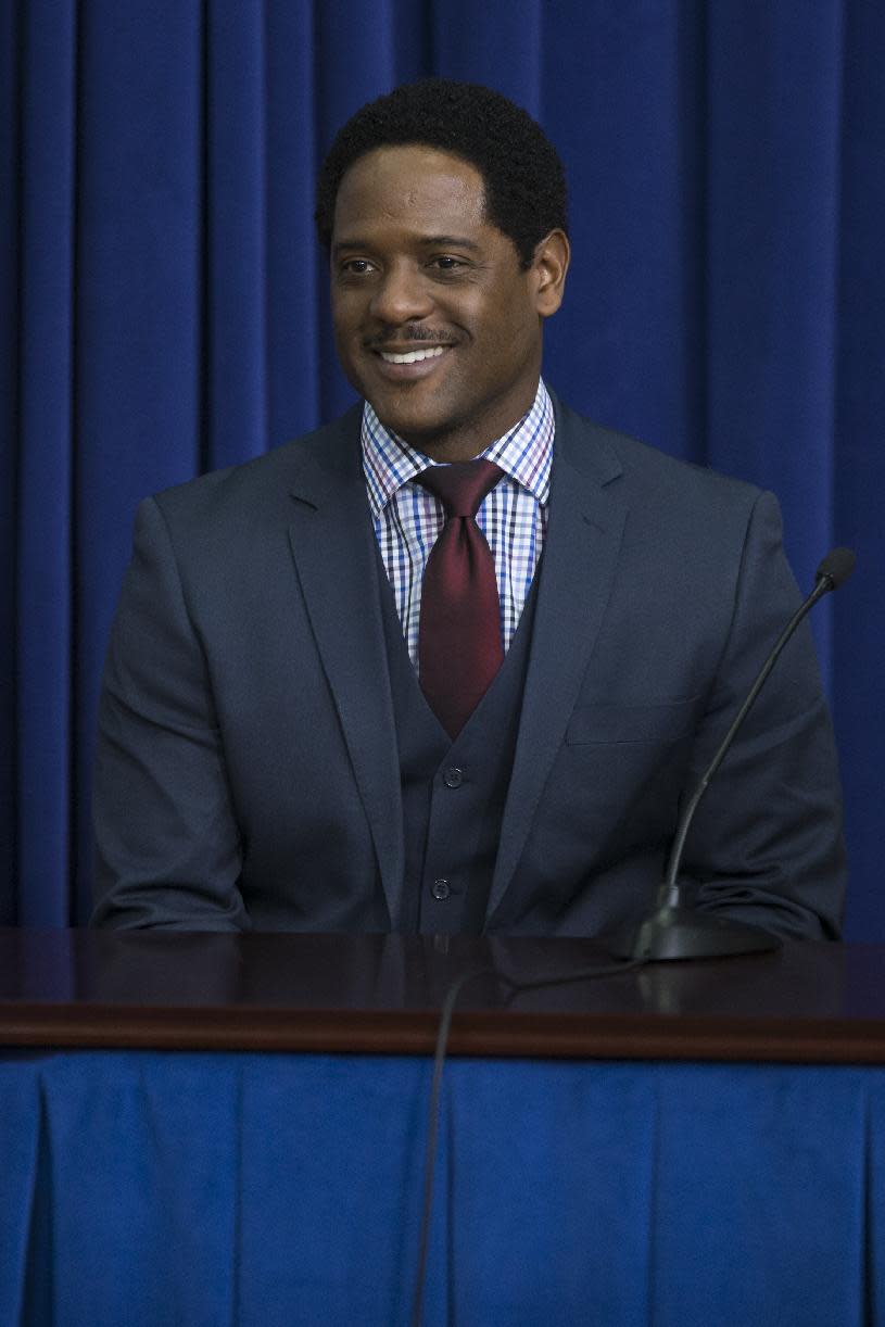 Actor Blair Underwood smiles during a roundtable discussion after a screening of the movie "The Trip to Bountiful" in the South Court Auditorium on the White House complex on Monday, Feb. 24, 2014, in Washington. (AP Photo/ Evan Vucci)