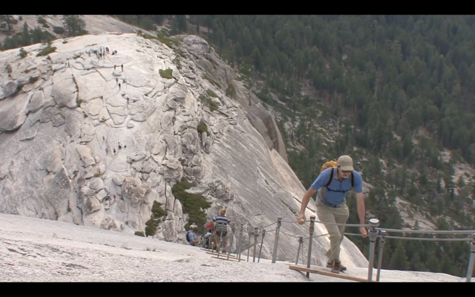 Man climbs up Yosemite’s Half Dome cables (National Park Service)