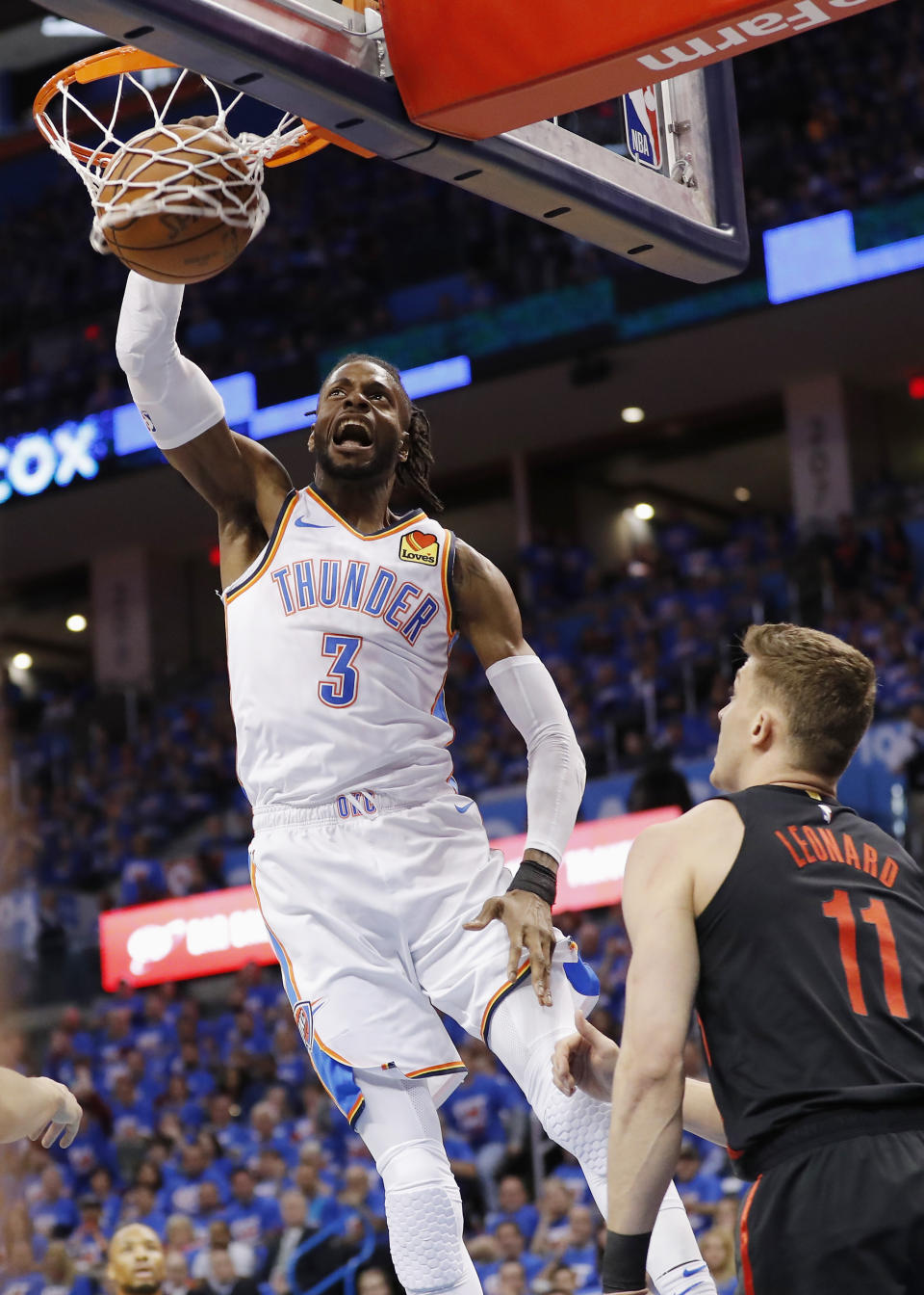 Oklahoma City Thunder forward Nerlens Noel (3) dunks as Portland Trail Blazers forward Meyers Leonard (11) looks on in the first half of Game 4 of an NBA basketball first-round playoff series Sunday, April 21, 2019, in Oklahoma City. (AP Photo/Alonzo Adams)