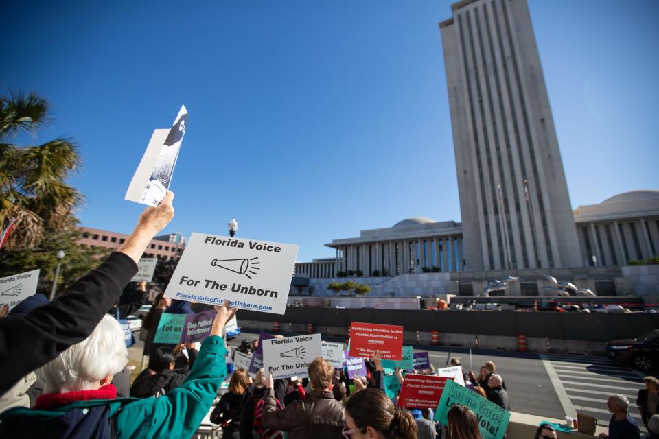 Abortion-rights and anti-abortion activists voice their opinions outside the Florida Supreme Court after the Court heard arguments on the proposed abortion amendment Wednesday, Feb. 7, 2024.