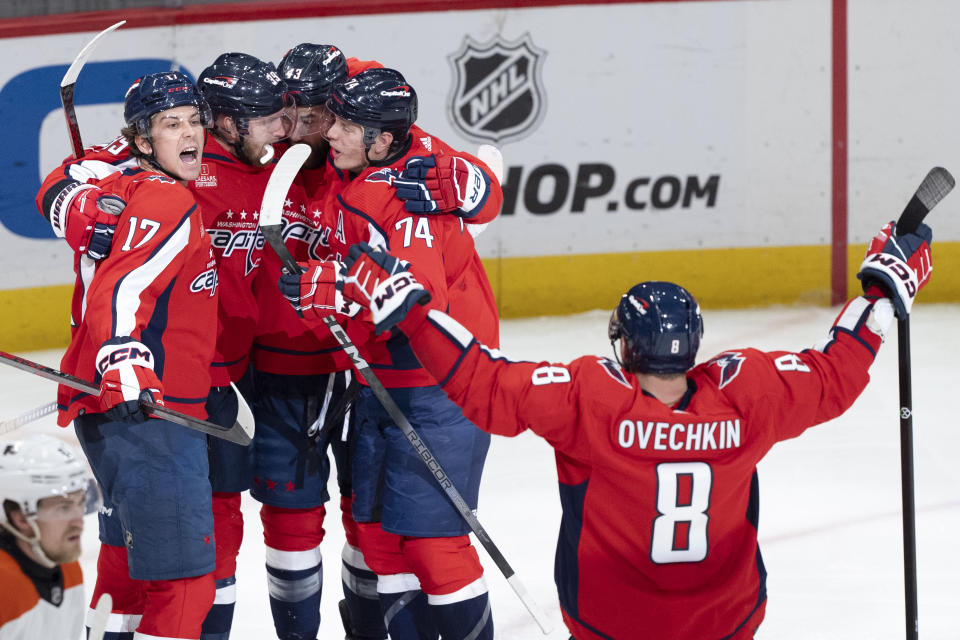 Washington Capitals center Dylan Strome (17), right wing Anthony Mantha (39), right wing Tom Wilson (43), defenseman John Carlson (74) and left wing Alex Ovechkin (8) celebrate a goal by Mantha during the third period of an NHL hockey game against the Philadelphia Flyers, Friday, March 1, 2024, in Washington. (AP Photo/Manuel Balce Ceneta)