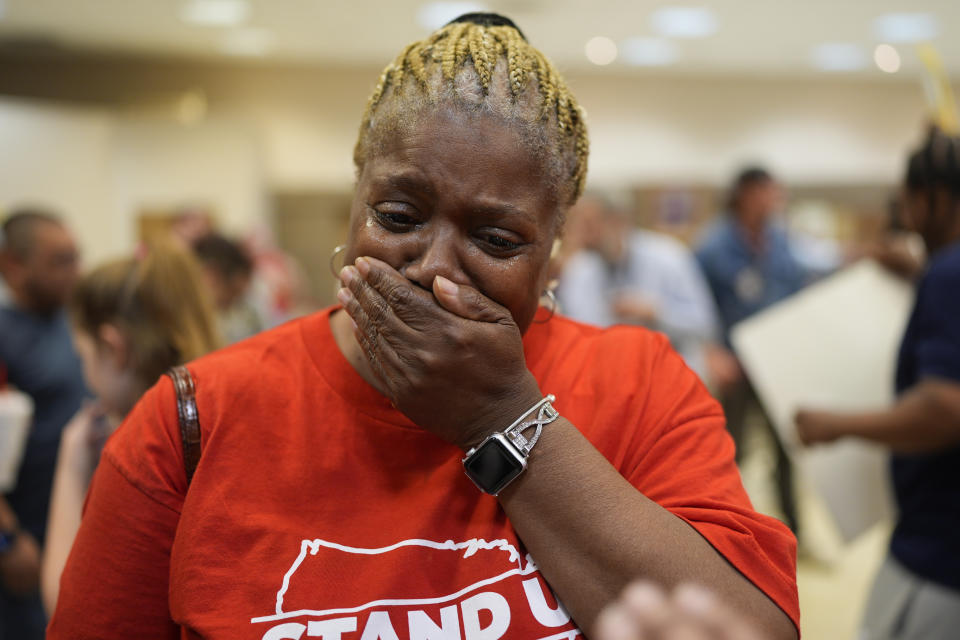 Volkswagen automobile plant employee Vicky Holloway becomes emotional as she celebrates after employees voted to join the UAW union Friday, April 19, 2024, in Chattanooga, Tenn. (AP Photo/George Walker IV)