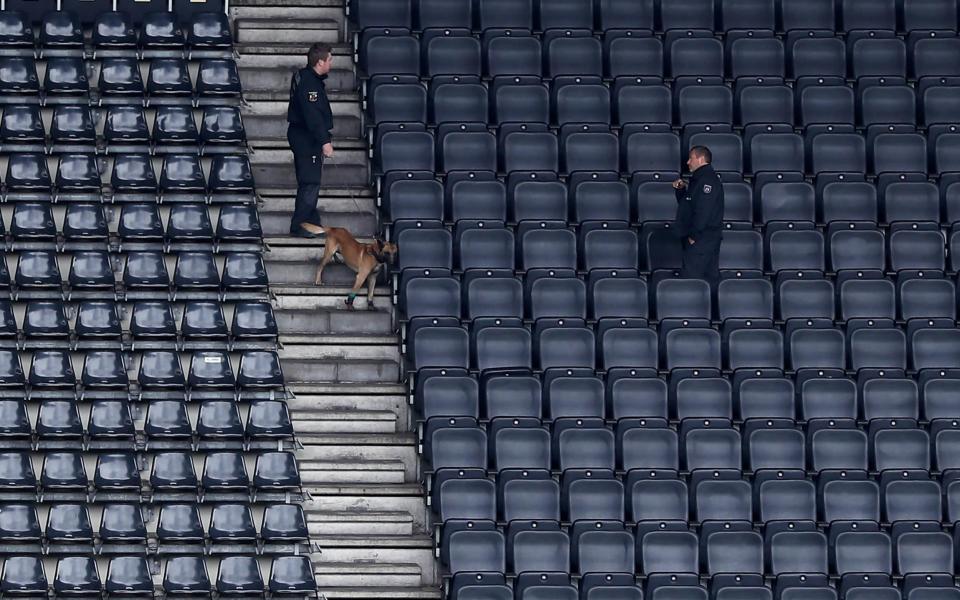 Stadium searches with explosive detection dogs - Credit: FRIEDEMANN VOGEL/EPA