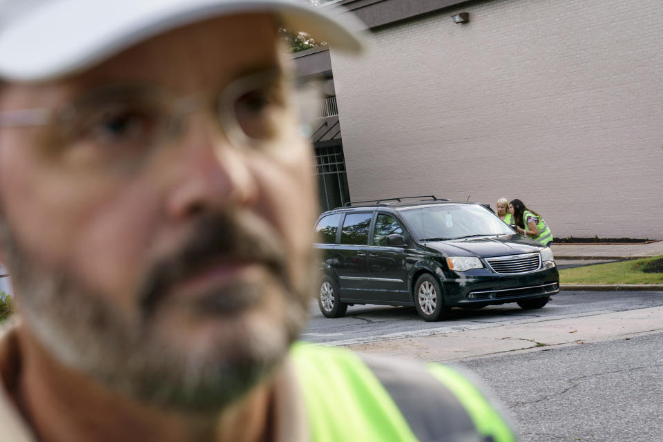 Mark Baumgartner, founder of the anti-abortion group, A Moment of Hope, watches the door of a Planned Parenthood clinic as members of his group are able to talk with a patient arriving for an abortion appointment, Friday, May 27, 2022, in Columbia, S.C. Last year, Baumgartner estimates about 1,600 women had an abortion at the clinic. They logged 66 saves. (AP Photo/David Goldman)