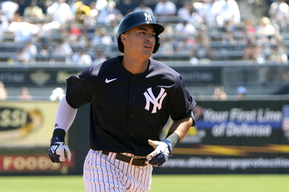 New York Yankees' Anthony Volpe rounds the bases after hitting a two run homer in the second inning of a spring training baseball game against the Minnesota Twins, Friday, March 24, 2023, in Tampa, Fla. (AP Photo/John Raoux)