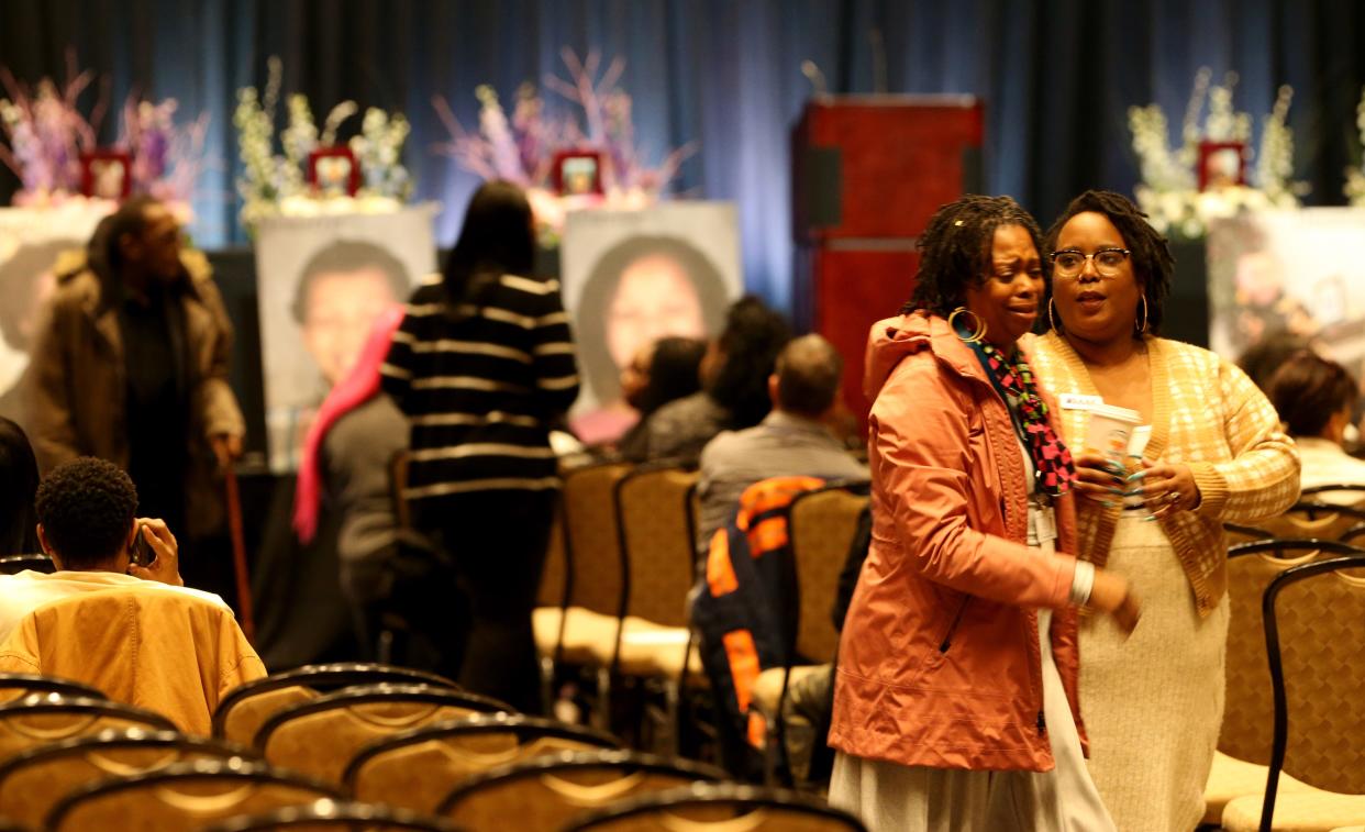 A woman consoles another Monday, Feb. 5, 2024, at a visitation and memorial service at Century Center in South Bend for the six children killed as a result of last month’s fatal house fore on North LaPorte Avenue.