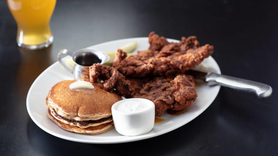 Yard House, known for having more than 100 beers on tap,  along with craft cocktails, tacos, burgers, seafood and steaks, served with a helping of rock music, opened Sunday at University Town Center. Shown above is Yard House Nashville Hot Chicken with Sweet Potato Pancakes.