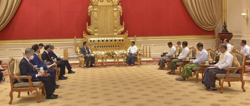 In this photo provided by the Myanmar Military True News Information Team, Senior Gen. Min Aung Hlaing, center right, head of the military council, talks with Chinese Foreign Minister Qin Gang, center left, during their meeting Tuesday, May 2, 2023, in Naypyitaw, Myanmar.The head of Myanmar's military-controlled government, Senior Gen. Min Aung Hlaing, met Tuesday with the visiting foreign minister of China, one of the army regime's closest allies offering key support to its continued rule since seizing power two years ago. (Military True News Information Team via AP)