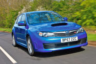 <p>The familiar three-box shape, with its giant rear aerofoil, was gone, and in its place came a blander-than-bland <strong>five door hatchback</strong>. Then, Subaru’s cost-cutting team combed through the interior, making it as cheap and coarse as they could. It seemed like a shameful way to treat an icon…</p>