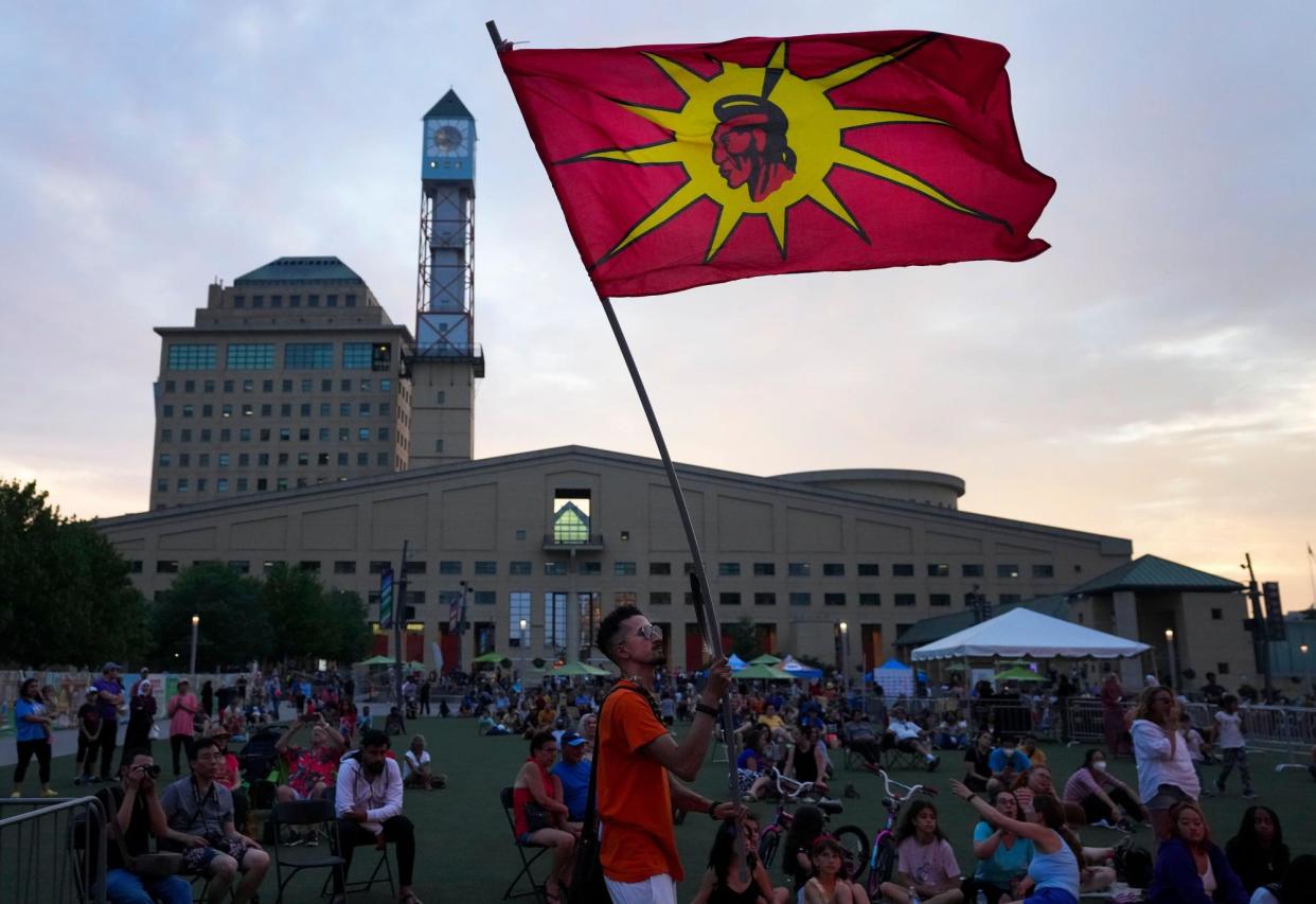 <span>A man waves a Six Nations flag during National Indigenous Peoples Day on 21 June 2022 in Mississauga, Ontario.</span><span>Photograph: The Canadian Press/Alamy</span>