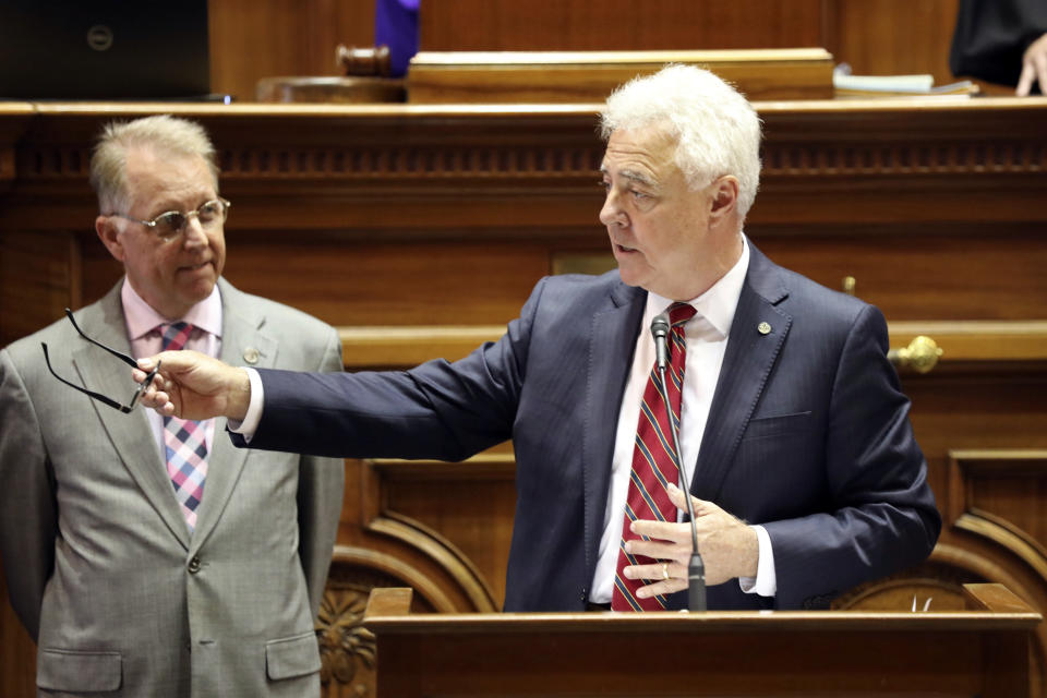 South Carolina state Sen. Larry Grooms, R-Bonneau, center, talks about a report about $1.8 billion found in an account created by the state Treasurer's Office as state Sen. Mike Fanning, D-Great Falls, left, listens, Tuesday, April 16, 2024, in Columbia, S.C. (AP Photo/Jeffrey Collins)