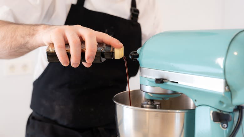 Pouring vanilla extract into KitchenAid