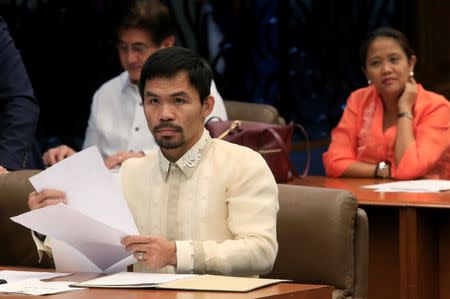 Senator and boxing champion Manny "Pacman" Pacquiao attends a session at the Senate headquarters in Pasay city, metro Manila, Philippines September 28, 2016. REUTERS/Romeo Ranoco