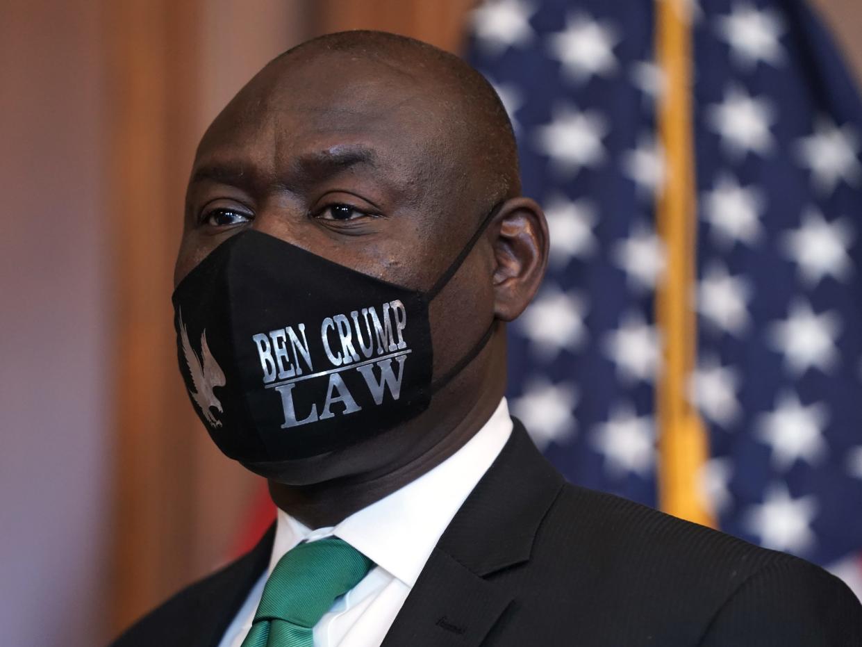 Attorney Benjamin Crump wearing  "Ben Crump Law" in Washington, DC as House Democrats and family members of George Floyd's family pose for a photo-op prior to a meeting to mark the one anniversary of his death, May 25, 2021 at the U.S. Capitol.