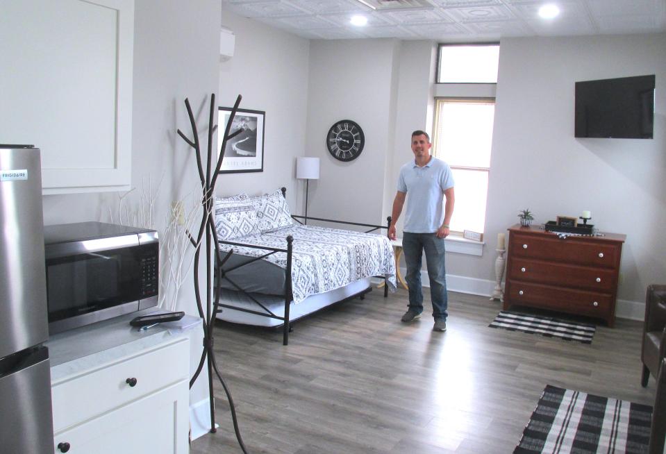 Billy Baker shows off the studio suite, one of three rooms available at The Baker Suites at 88 E. Jackson St. in downtown Millersburg.