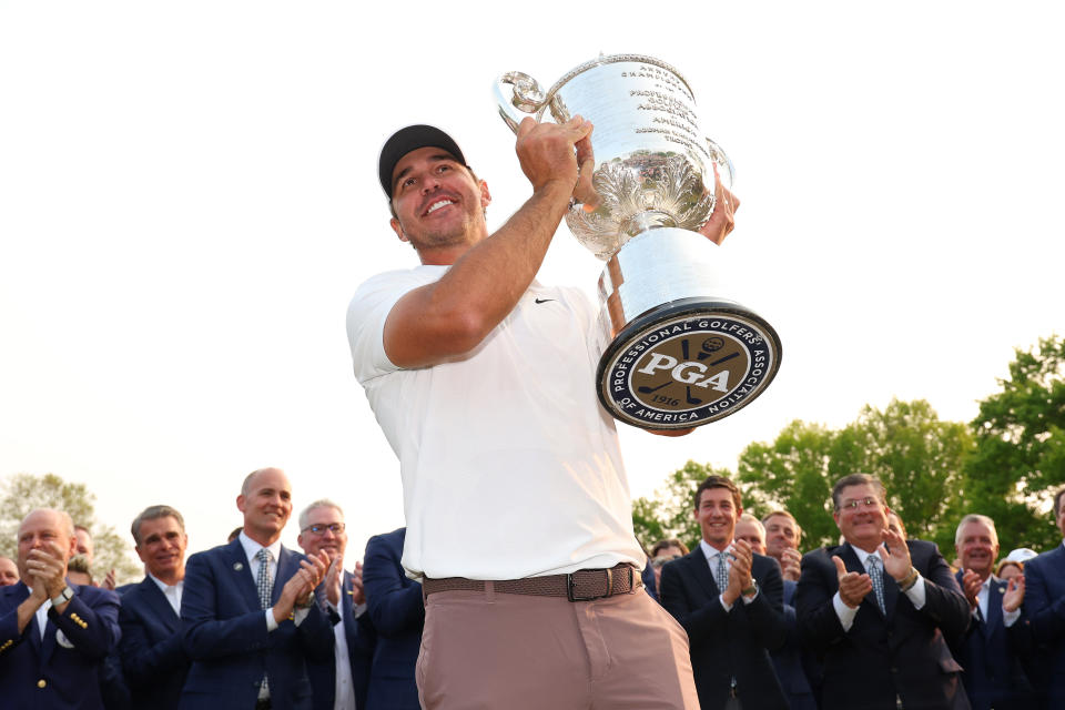 Brooks Koepka celebrates with the Wanamaker Trophy after winning the 2023 PGA Championship at Oak Hill Country Club. (Michael Reaves/Getty Images)