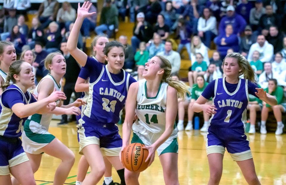 Eureka's Ellie Cahill (14) looks to the basket at Canton's Allison Wheeler defends in the second half of the Class 2A Girls Basketball Eureka Regional title game Friday, Feb. 17, 2023 in Eureka. The Hornets defeated the Little Giants 61-55 in overtime.