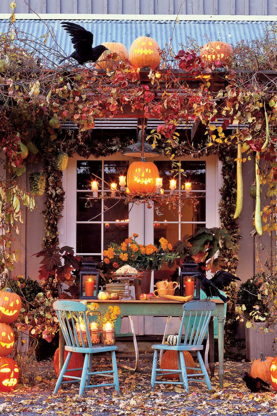 <p>Create a show-stopping Halloween entrance with fall leaves, pumpkins, and faux ravens. </p>