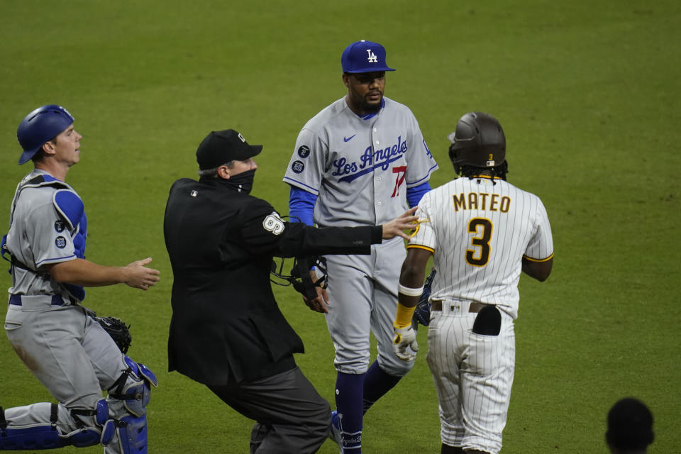 Los Angeles Dodgers pitcher Dennis Santana has words with Jorge Mateo.