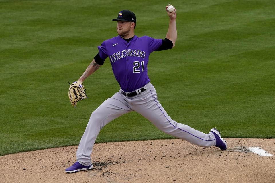 Colorado Rockies starting pitcher Kyle Freeland (21) throws against the Oakland Athletics during the first inning of a spring training baseball game, Tuesday, March 23, 2021, in Mesa, Ariz. (AP Photo/Matt York)