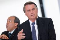 FILE PHOTO: Brazil's President Jair Bolsonaro attends a signing decrees ceremony of gas assistance in Brasilia