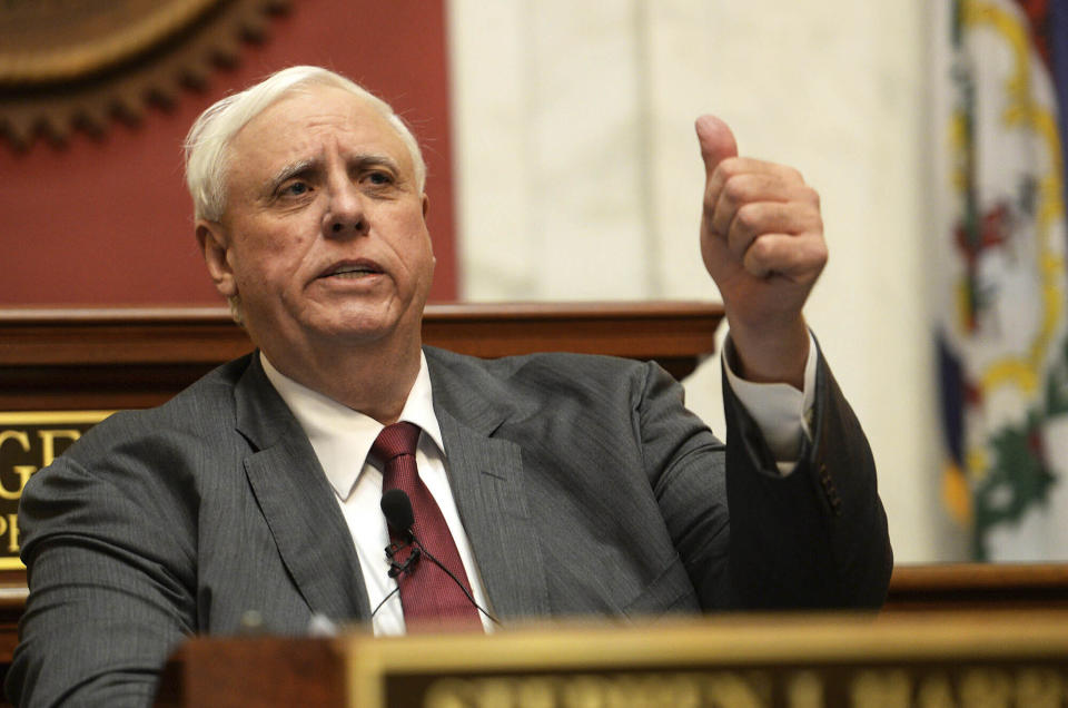 File-This Jan. 9, 2019, file photo shows West Virginia Gov. Jim Justice delivering his State of the State address in the House of Delegates' Chamber in Charleston, W.Va. A lawsuit seeking to force Justice to live in the state capital is expected to be back in court. A hearing in the case brought by Democratic Del. Isaac Sponaugle is scheduled for Wednesday, Aug. 21, 2019, in Charleston. (Chris Dorst/Charleston Gazette-Mail via AP, File)