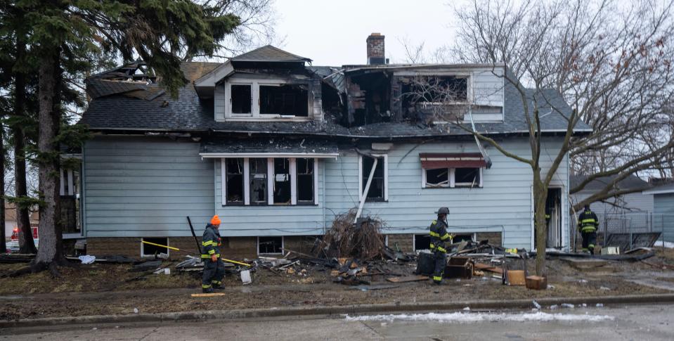Firefighters work at the scene of a triple fatality fire Wednesday, March 29, 2023 at the intersection of N. 33rd St. and W. Fairmount Ave. in Milwaukee, Wis.