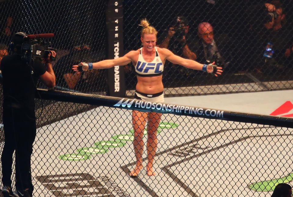 MELBOURNE, AUSTRALIA - NOVEMBER 15:  New UFC women's bantamweight champion Holly Holm of the United States celebrates her victory over Ronda Rousey of the United States in their UFC women's bantamweight championship bout during the UFC 193 event at Etihad Stadium on November 15, 2015 in Melbourne, Australia.  (Photo by Scott Barbour /Zuffa LLC/Zuffa LLC via Getty Images)