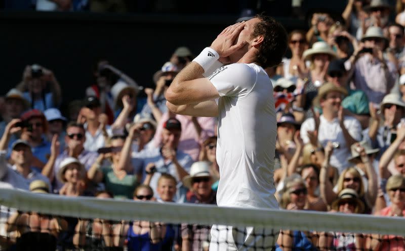 Andy Murray of Britain celebrates as he defeats Novak Djokovic of Serbia in their men's singles final tennis match at the Wimbledon Tennis Championships, in London