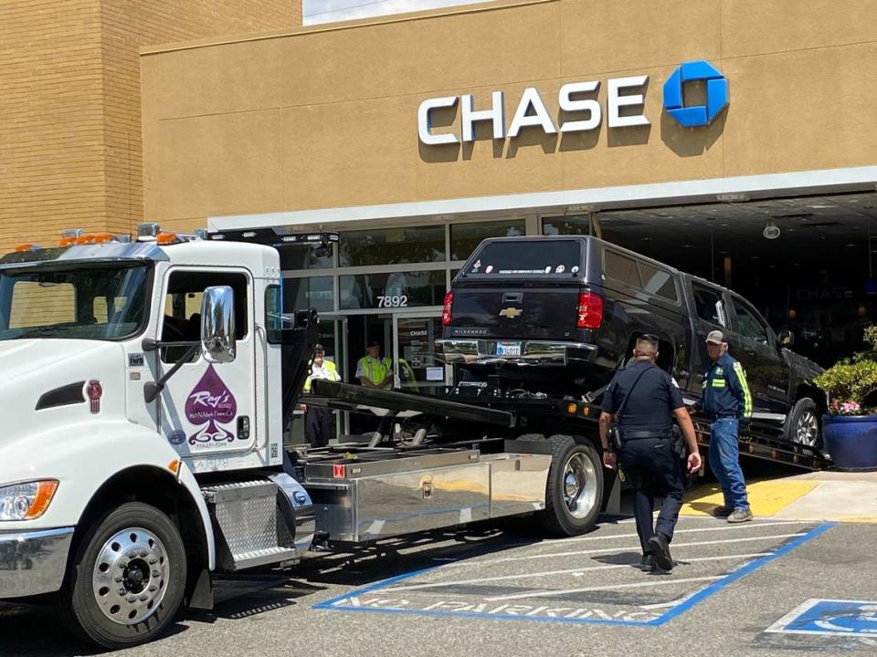 Three people were injured in Fresno inside a River Park bank on when a truck crashed through the front of the Chase Bank building.