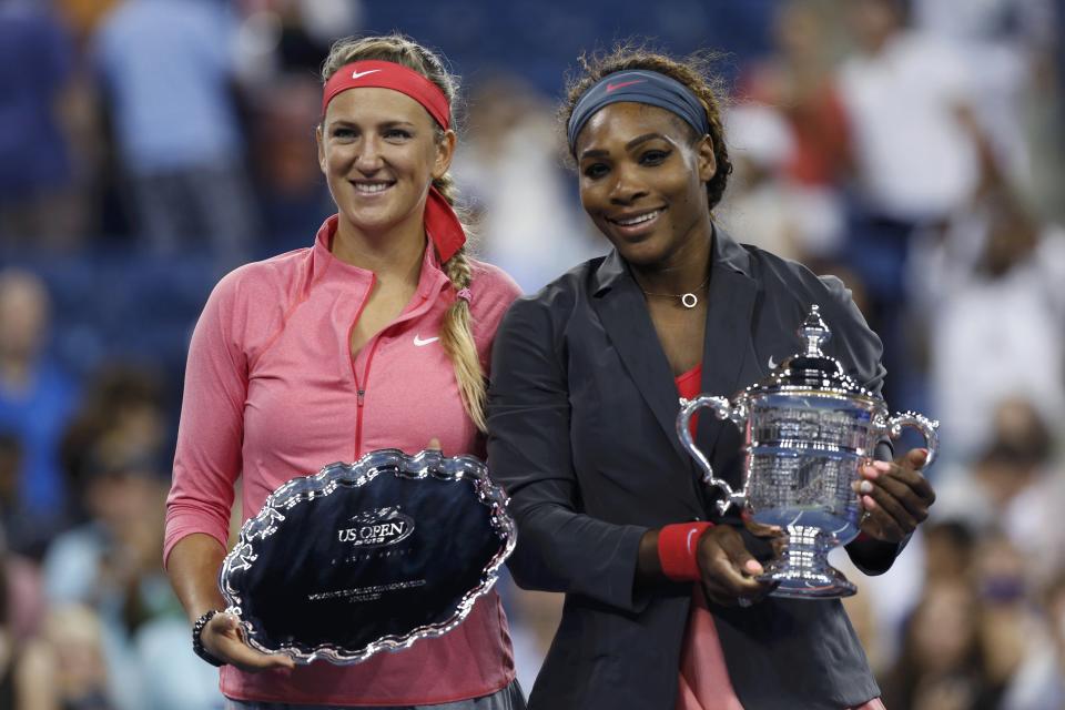 Serena Williams of the U.S. holds her winner's trophy as Azarenka of Belarus holds the runner up trophy after Williams won their women's singles final match at the U.S. Open tennis championships in New York