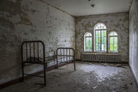 <p>Another odd sight: a pillow left on the bed frame in an otherwise empty room. (Caters News) </p>