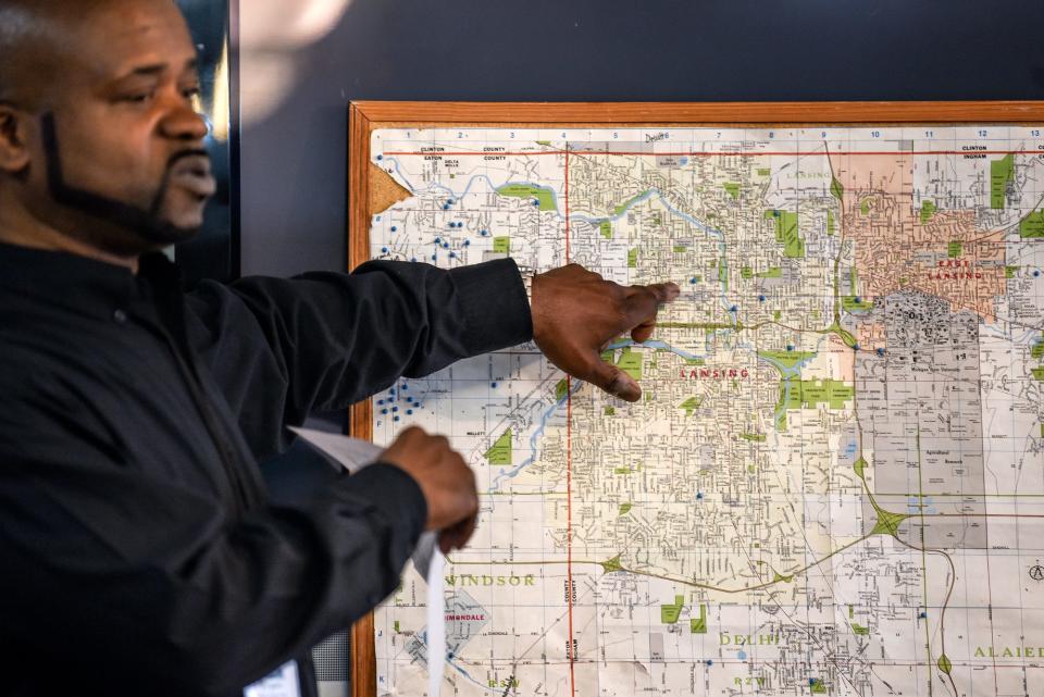 Bryan McGruder, with Projects in Assisting the Transition from Homelessness, goes over a map during a planning meeting for a Point in Time Count of the number of people who are homeless on Thursday, Jan. 23, 2020, at the Advent House Ministries in Lansing.