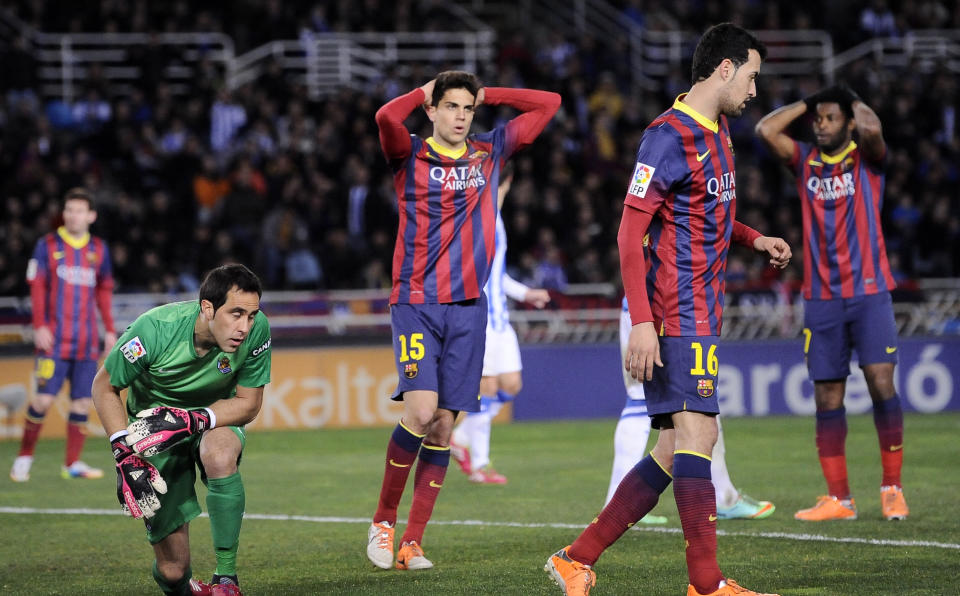 FC Barcelona's Marc Bartra reacts after missing a goal against Real Sociedad, during their Spanish League soccer match, at Anoeta stadium in San Sebastian, Spain, Saturday, Feb. 22, 2014. FC Barcelona lost the match 3-1. (AP Photo/Alvaro Barrientos)