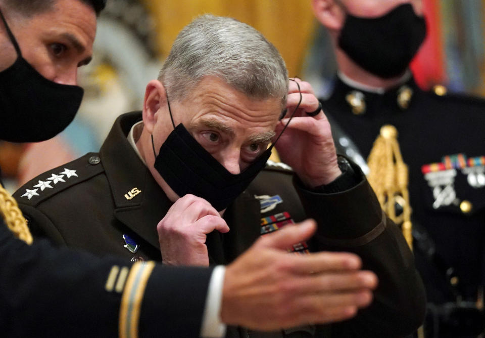 Chairman of the Joint Chiefs of Staff Gen. Mark Milley puts his face mask back on after a ceremony where U.S. President Donald Trump presented the Medal of Honor to U.S. Army Sgt. Maj. Thomas P. Payne for conspicuous gallantry during a hostage rescue mission in Iraq, at the White House in Washington, U.S., September 11, 2020.  (Kevin Lamarque/Reuters)