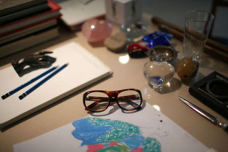 The glasses of Yves Saint Laurent are seen on his desk at the Studio where all the collections where designed in the Yves Saint Laurent Museum in Paris, France, September 27, 2017. The new museum, celebrating the life and work of French designer Yves Saint Laurent (1936-2008), will open at the avenue Marceau address of his former work studio for almost 30 years. Picture taken September 27, 2017. REUTERS/Stephane Mahe