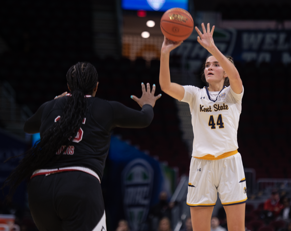 Lindsey Thall takes a shot, A'Jah Davis on defense.