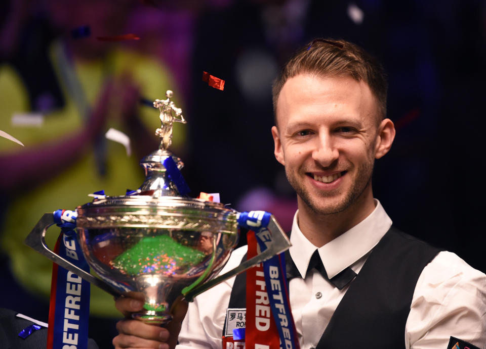 Judd Trump celebrates winning the 2019 Betfred World Snooker Championship final at Crucible Theatre (Photo by Nathan Stirk/Getty Images)