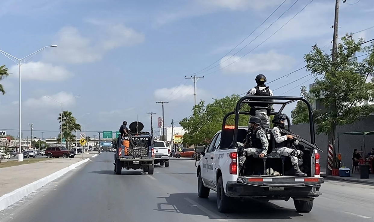 National Guard and military vehicles take part in an operation to transfer two of the four U.Ss citizens kidnapped in Mexico's crime-ridden northeast back to Brownsville, Texas, after the other two were found dead, in Matamoros, Mexico, on March 7.