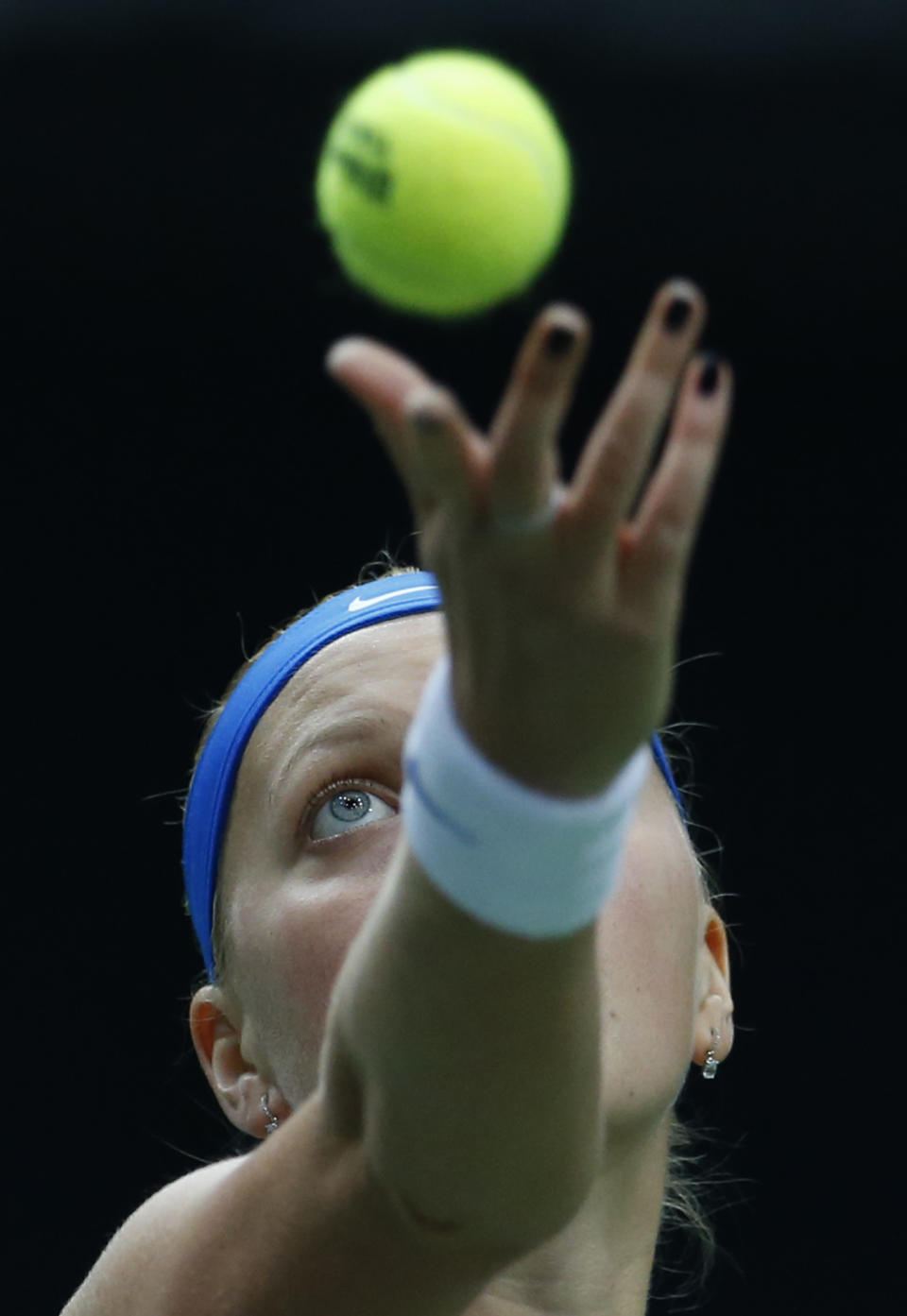 Czech Republic's Petra Kvitova serves a ball to Italy's Roberta Vinci during their Fed Cup semifinal tennis match in Ostrava, Czech Republic, Sunday, April 20, 2014. (AP Photo/Petr David Josek)